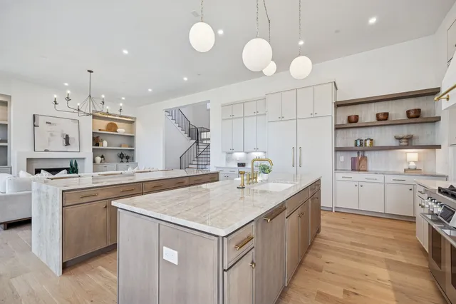 a bathroom with a granite countertop sink a toilet and a mirror