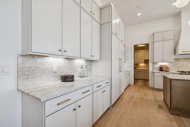 a bathroom with a tub sink shower and mirror