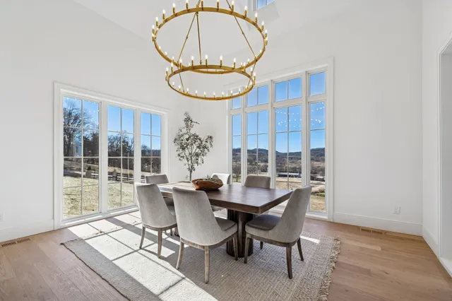 an empty room with wooden floor and a window
