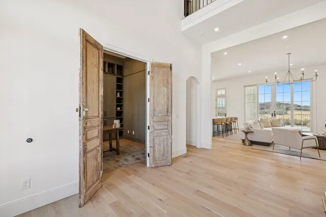 a view of a room with a table and chairs