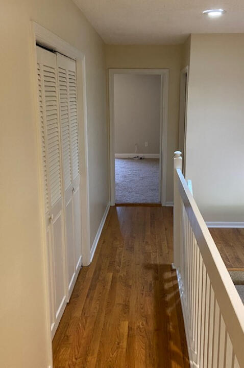 2985 Bent Pine Drive Fort Pierce, FL 34951 - Photo 11 of 29 a hallway with wooden floor
