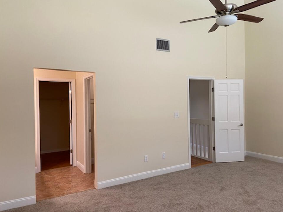 2985 Bent Pine Drive Fort Pierce, FL 34951 - Photo 18 of 29 an empty room with a door and a hallway