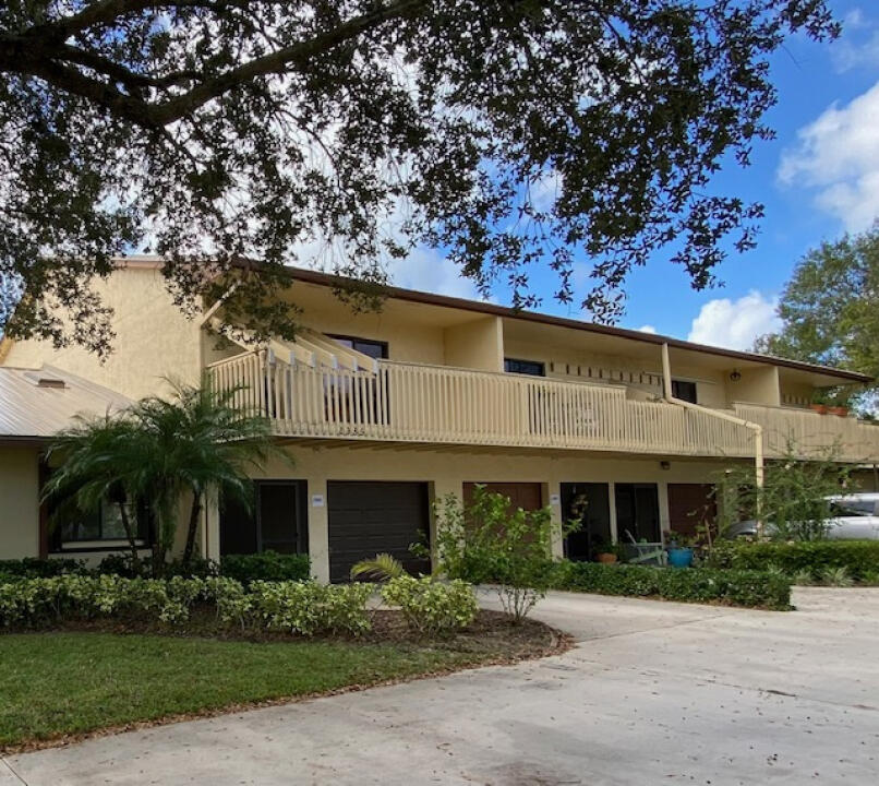 2985 Bent Pine Drive Fort Pierce, FL 34951 - Photo 2 of 29 a front view of a house with garden