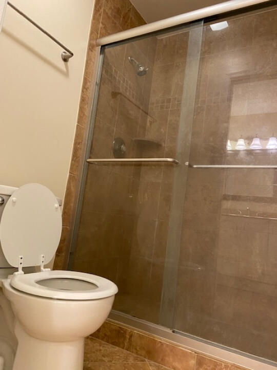 2985 Bent Pine Drive Fort Pierce, FL 34951 - Photo 21 of 29 a bathroom with a toilet and a shower