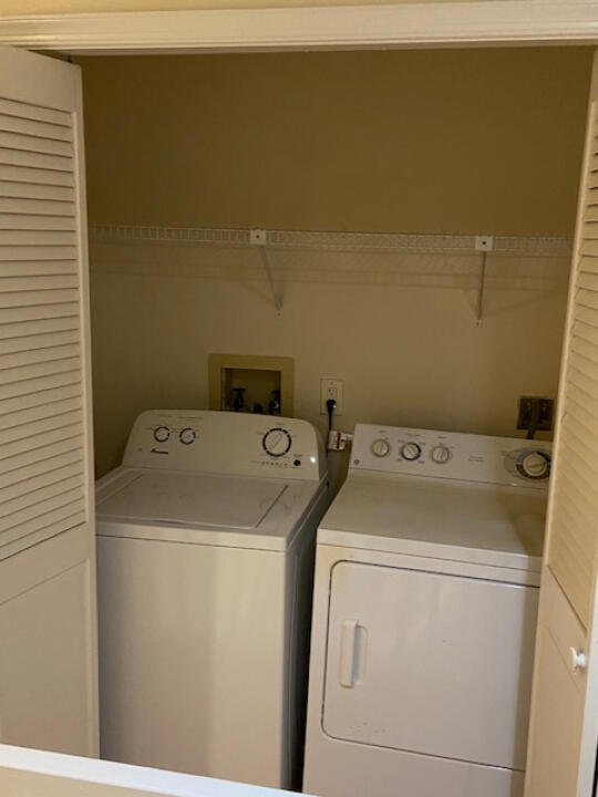 2985 Bent Pine Drive Fort Pierce, FL 34951 - Photo 23 of 29 a utility room with dryer and washer