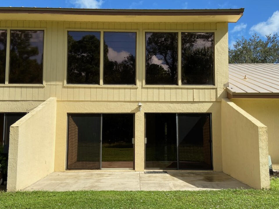 2985 Bent Pine Drive Fort Pierce, FL 34951 - Photo 27 of 29 a view of front door of a house with a yard