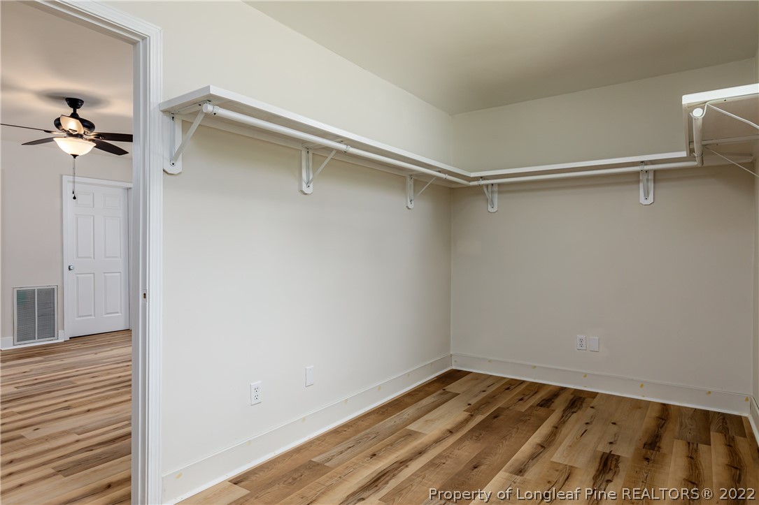 344 J Burns Road Vass, NC 28394 - Photo 13 of 50 a view of a room with wooden floor and cabinet
