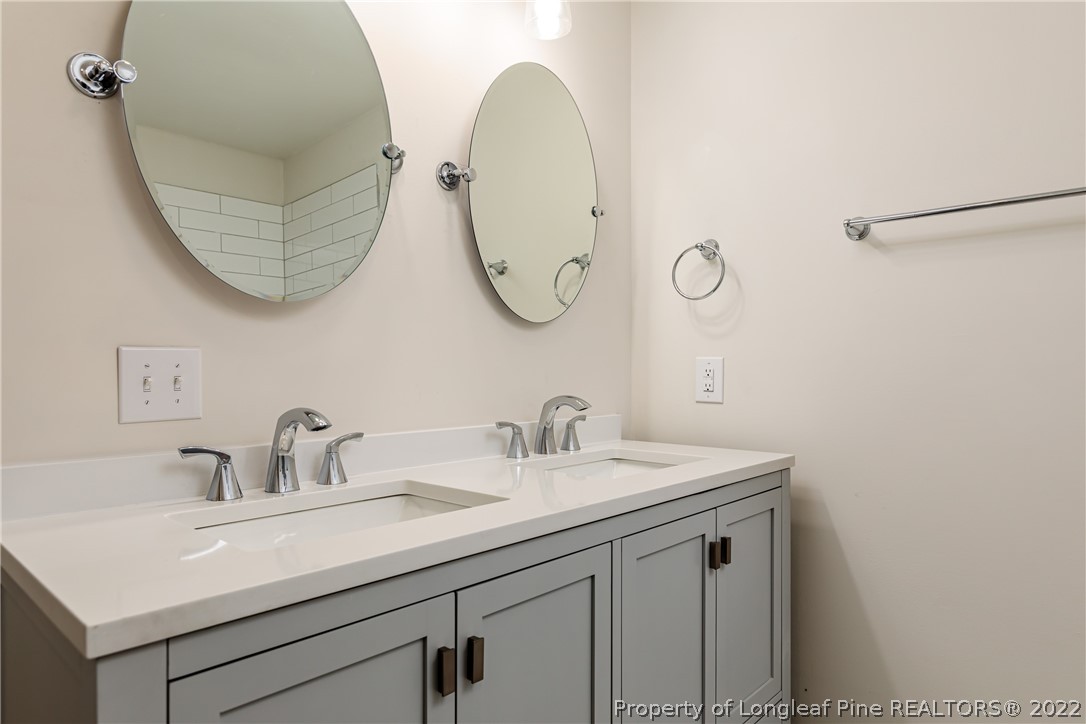 344 J Burns Road Vass, NC 28394 - Photo 14 of 50 a bathroom with a sink and a mirror