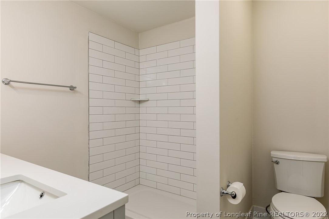 344 J Burns Road Vass, NC 28394 - Photo 15 of 50 a bathroom with a toilet and sink