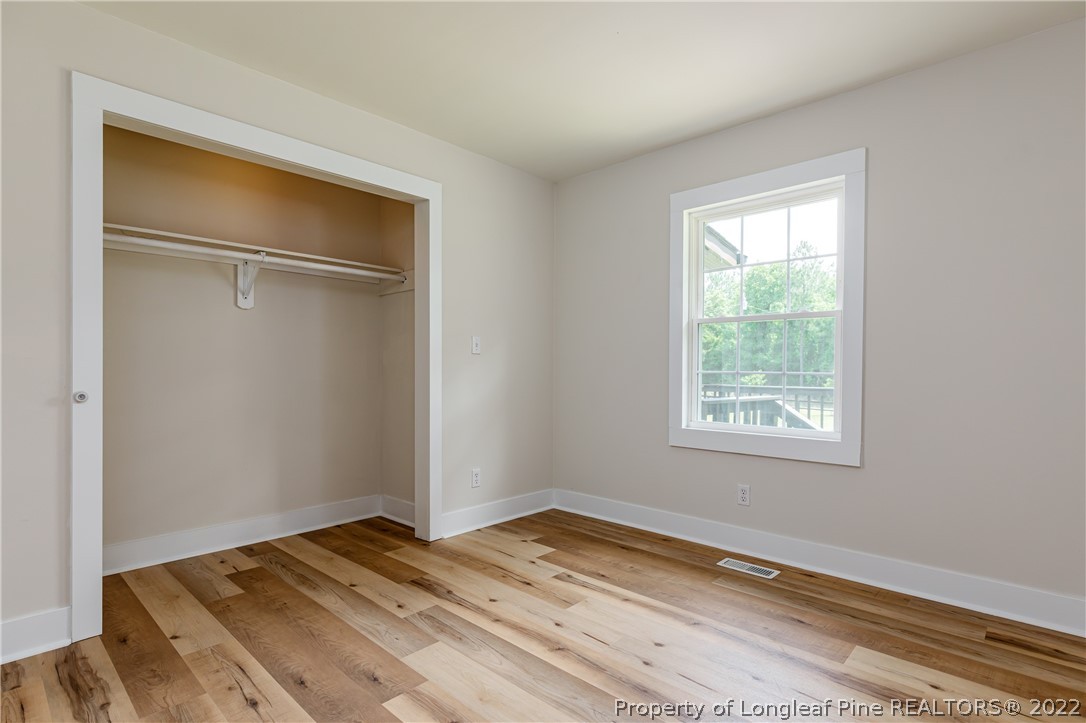 344 J Burns Road Vass, NC 28394 - Photo 18 of 50 a view of a room that has a bed and a window in it