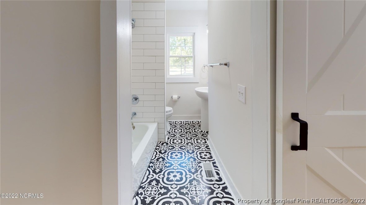 344 J Burns Road Vass, NC 28394 - Photo 19 of 50 a view of bathroom with bathtub and shower
