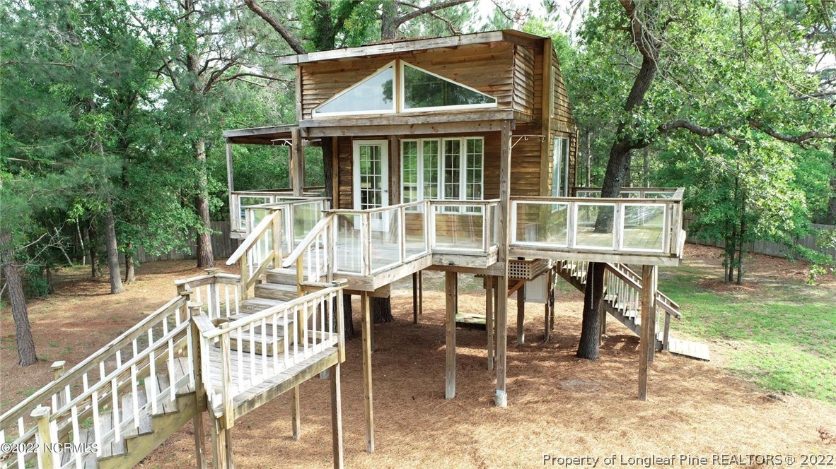 344 J Burns Road Vass, NC 28394 - Photo 2 of 50 a view of a house with backyard porch and sitting area