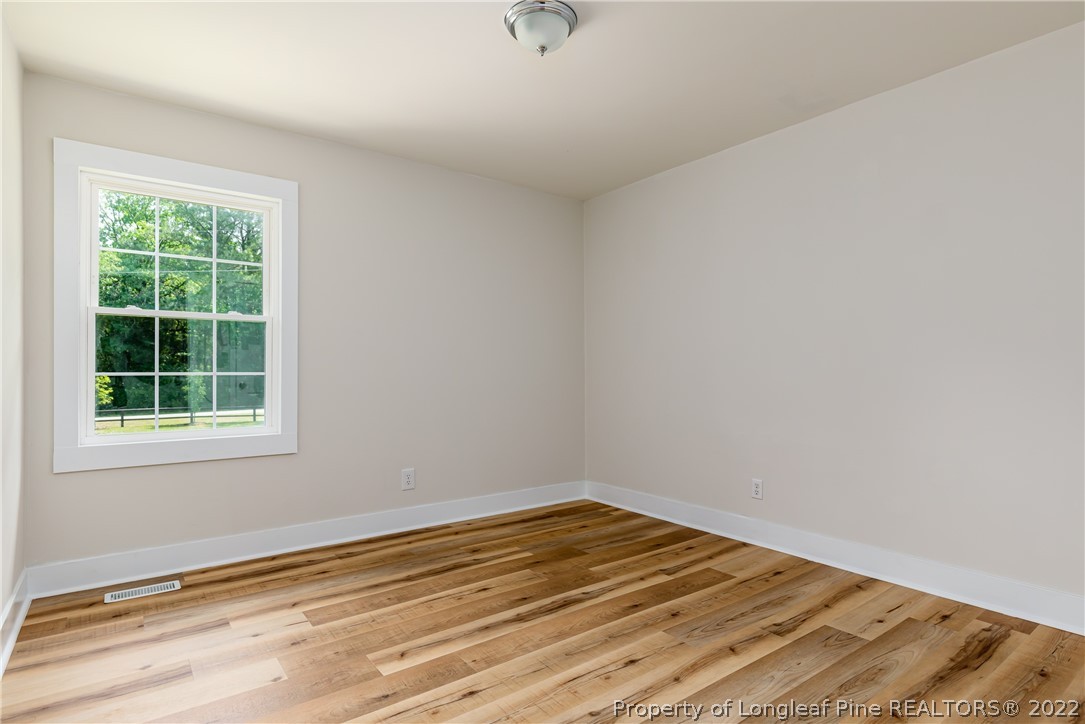 344 J Burns Road Vass, NC 28394 - Photo 23 of 50 an empty room with a window