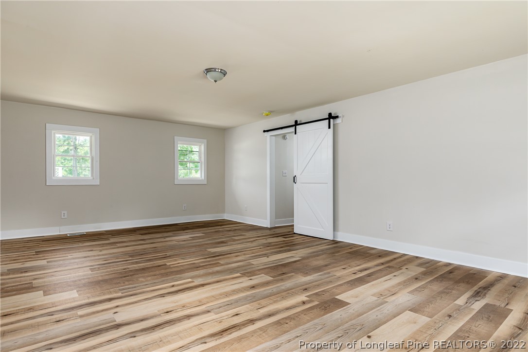 344 J Burns Road Vass, NC 28394 - Photo 27 of 50 a view of an empty room with window and closet area