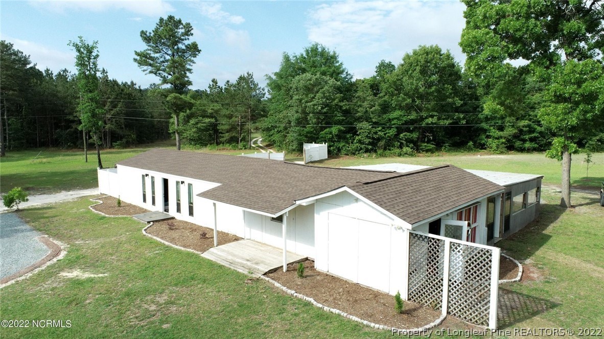 344 J Burns Road Vass, NC 28394 - Photo 3 of 50 an aerial view of a house having yard and patio