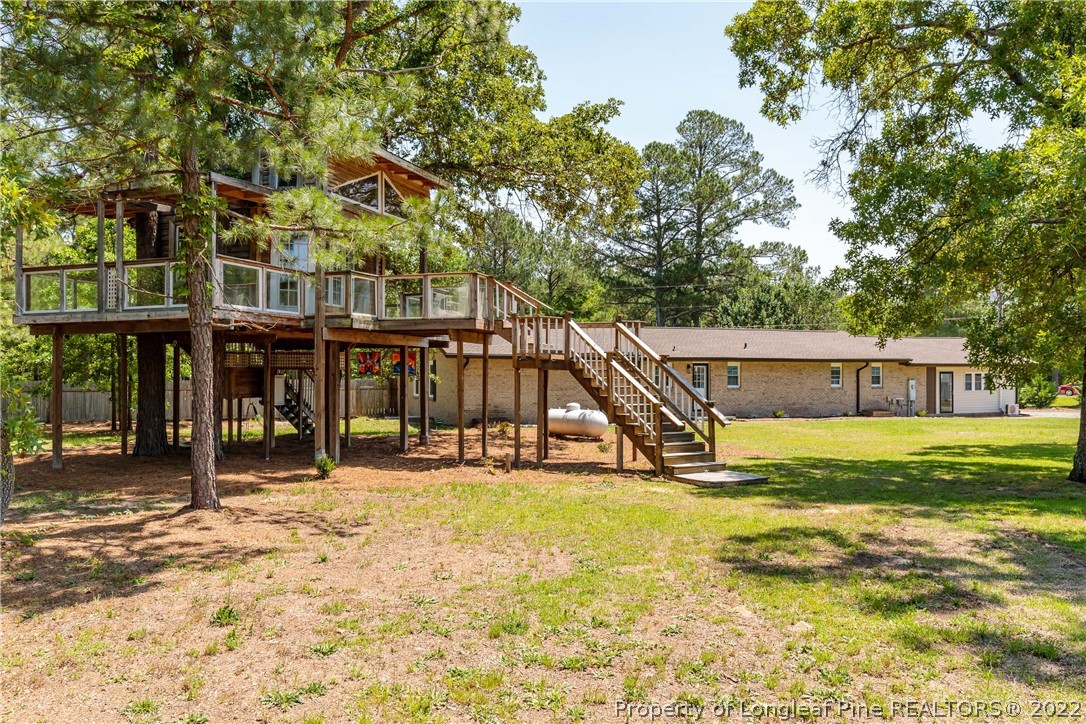 344 J Burns Road Vass, NC 28394 - Photo 34 of 50 a view of a house with a swimming pool