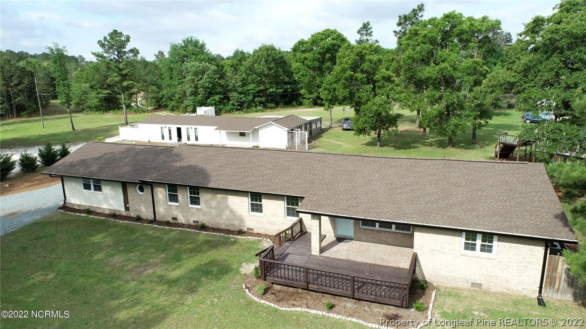 344 J Burns Road Vass, NC 28394 - Photo 36 of 50 an aerial view of a house with swimming pool garden and patio