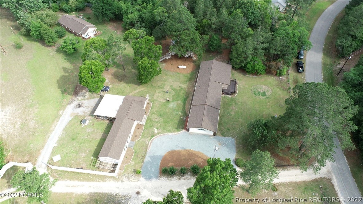 344 J Burns Road Vass, NC 28394 - Photo 4 of 50 an aerial view of a residential houses with outdoor space and street view