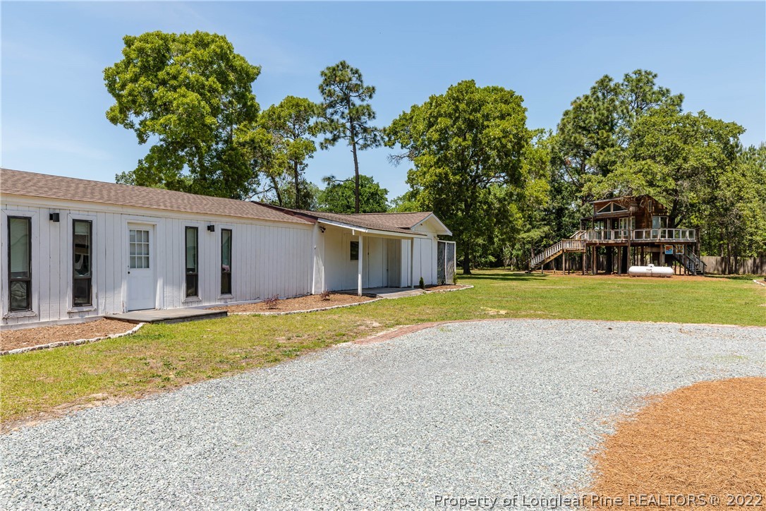 344 J Burns Road Vass, NC 28394 - Photo 46 of 50 a view of a house with a outdoor space