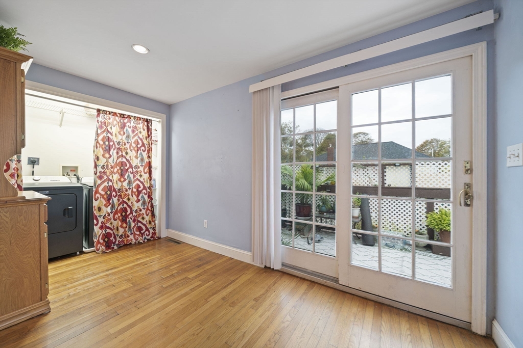53 Mountford Road Hull, MA 02045 - Photo 11 of 35 a view of an empty room with wooden floor and a window