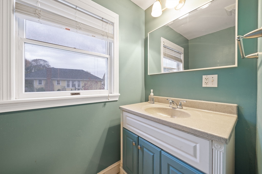 53 Mountford Road Hull, MA 02045 - Photo 14 of 35 a bathroom with a sink and a mirror
