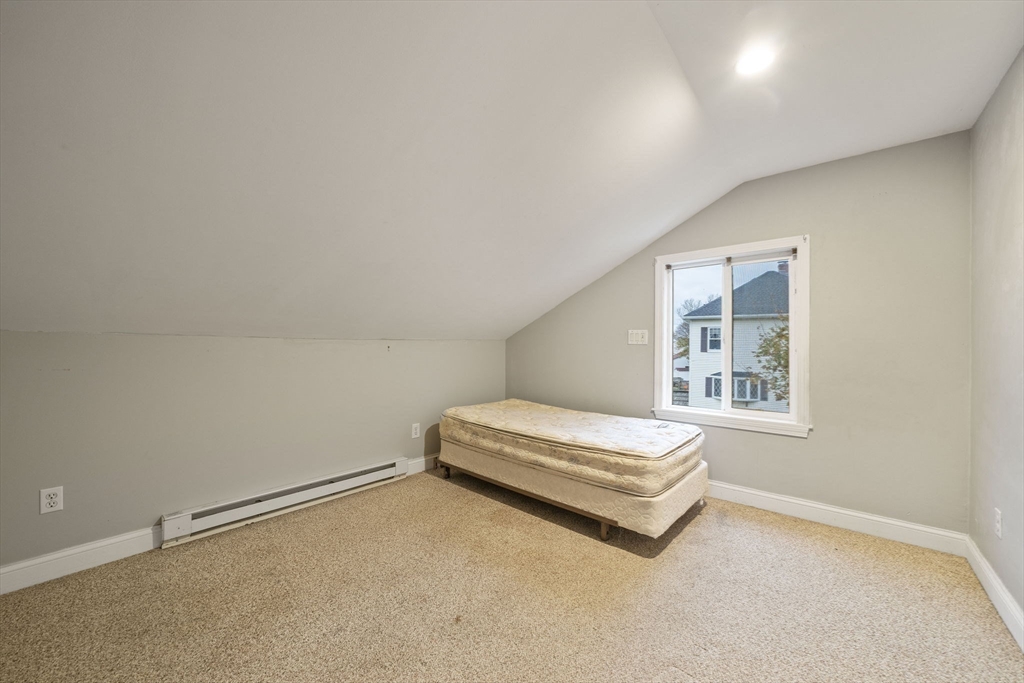 53 Mountford Road Hull, MA 02045 - Photo 17 of 35 a spacious bedroom with a bed and a window