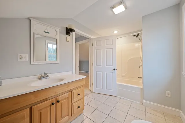 a bathroom with a sink a vanity and a mirror