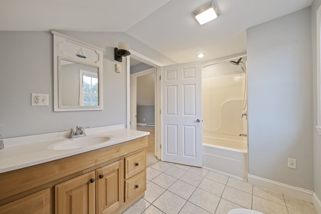 53 Mountford Road Hull, MA 02045 - Photo 23 of 35 a bathroom with a sink a vanity and a mirror