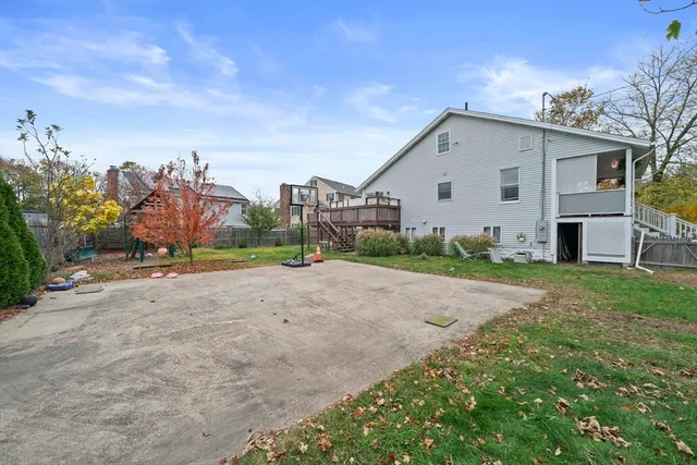 a view of a house with a yard and garage