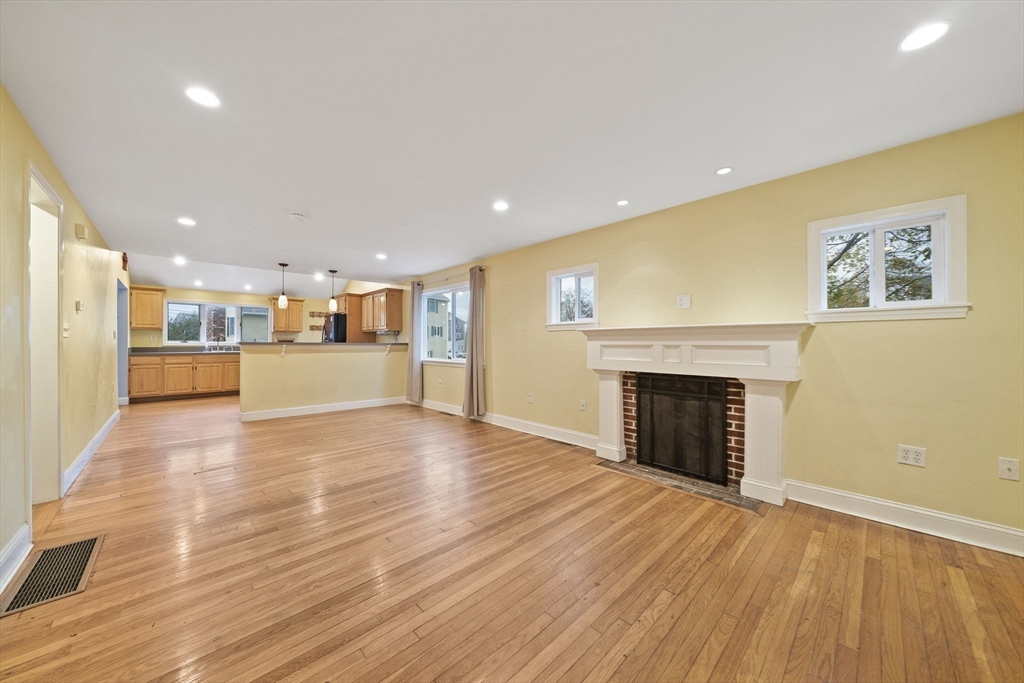 53 Mountford Road Hull, MA 02045 - Photo 3 of 35 a view of a kitchen with a sink and a fireplace