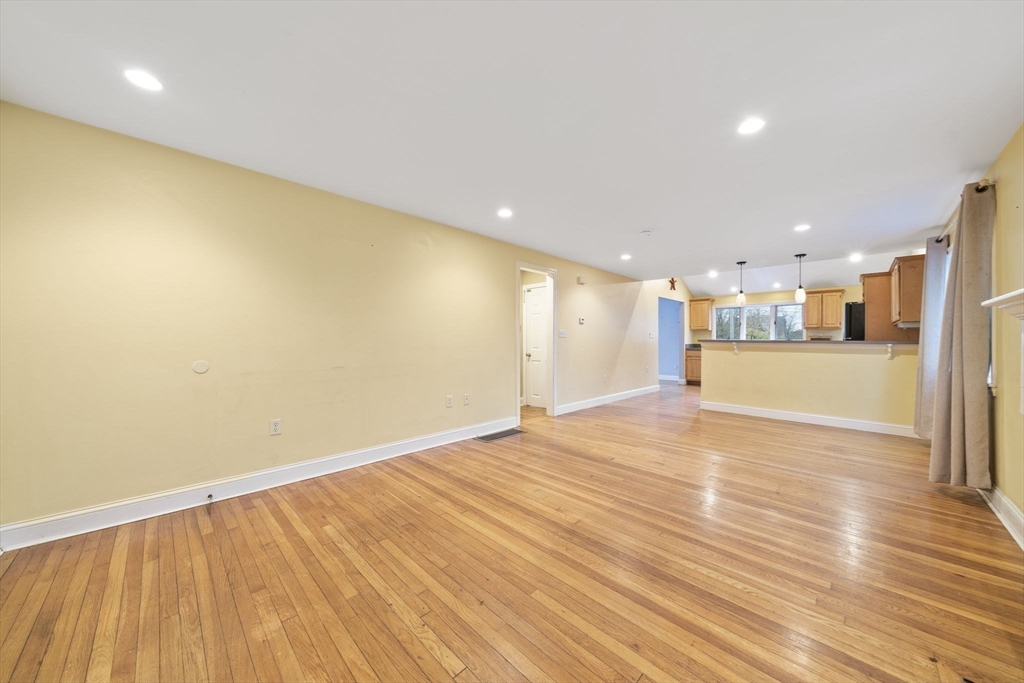 53 Mountford Road Hull, MA 02045 - Photo 4 of 35 a view of an empty room with wooden floor