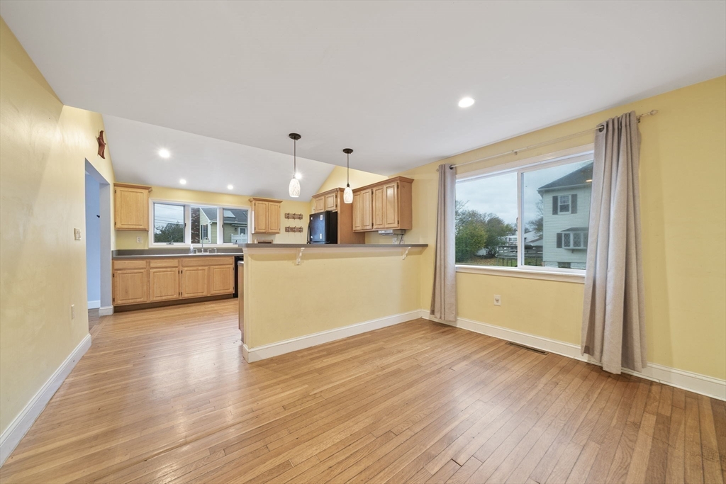 53 Mountford Road Hull, MA 02045 - Photo 5 of 35 a view of a kitchen with furniture and wooden floor