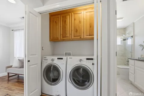 a view of a hallway with washer and dryer