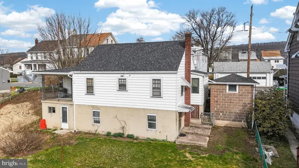 a aerial view of a house with a yard