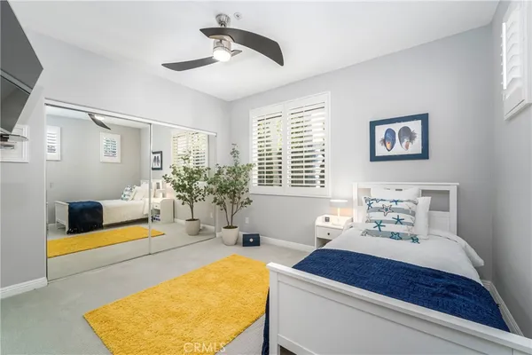 a bedroom with furniture and a window