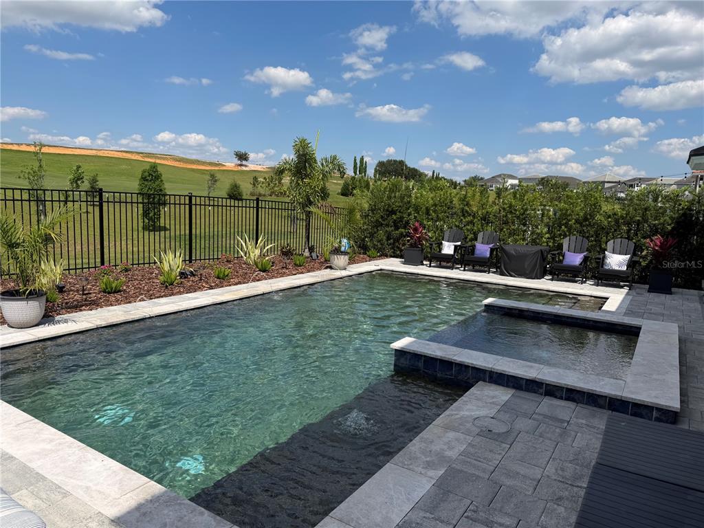 16136 Volterra Point Bella Collina, FL 34756 - Photo 45 of 64 a view of a swimming pool with a patio