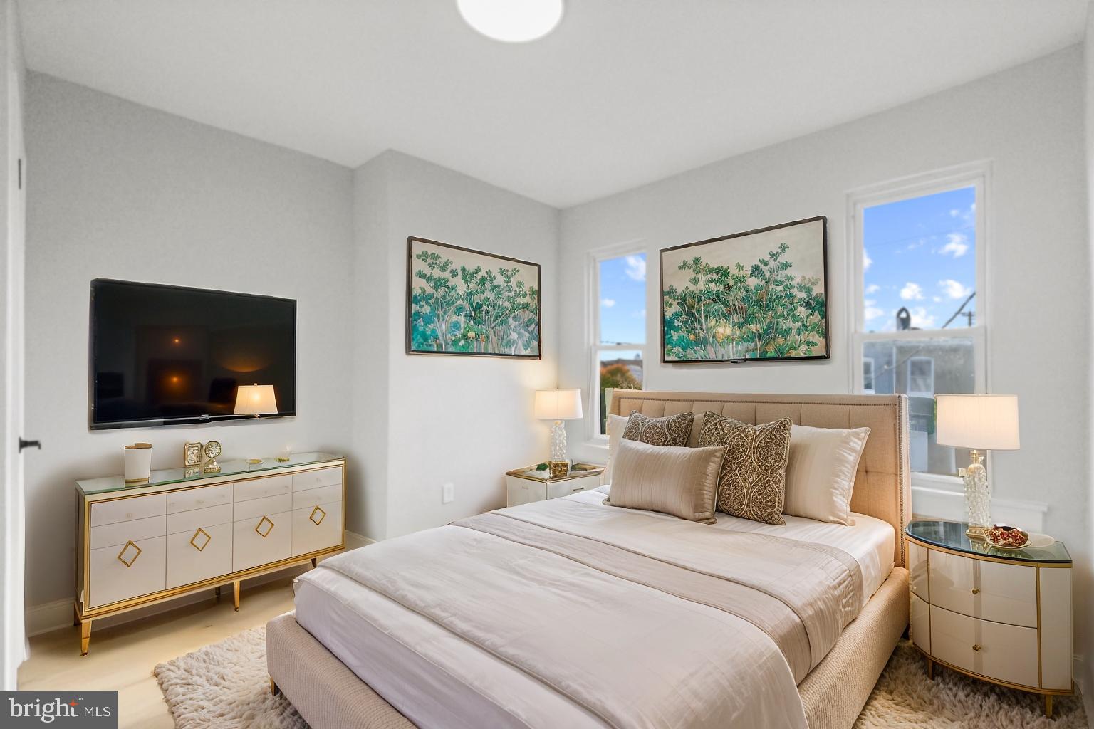 653 Bartlett Avenue Baltimore, MD 21218 - Photo 14 of 39 a bedroom with a bed and a flat screen tv