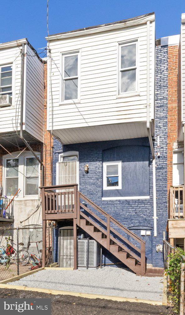 653 Bartlett Avenue Baltimore, MD 21218 - Photo 36 of 39 a view of a house with a balcony and stairs