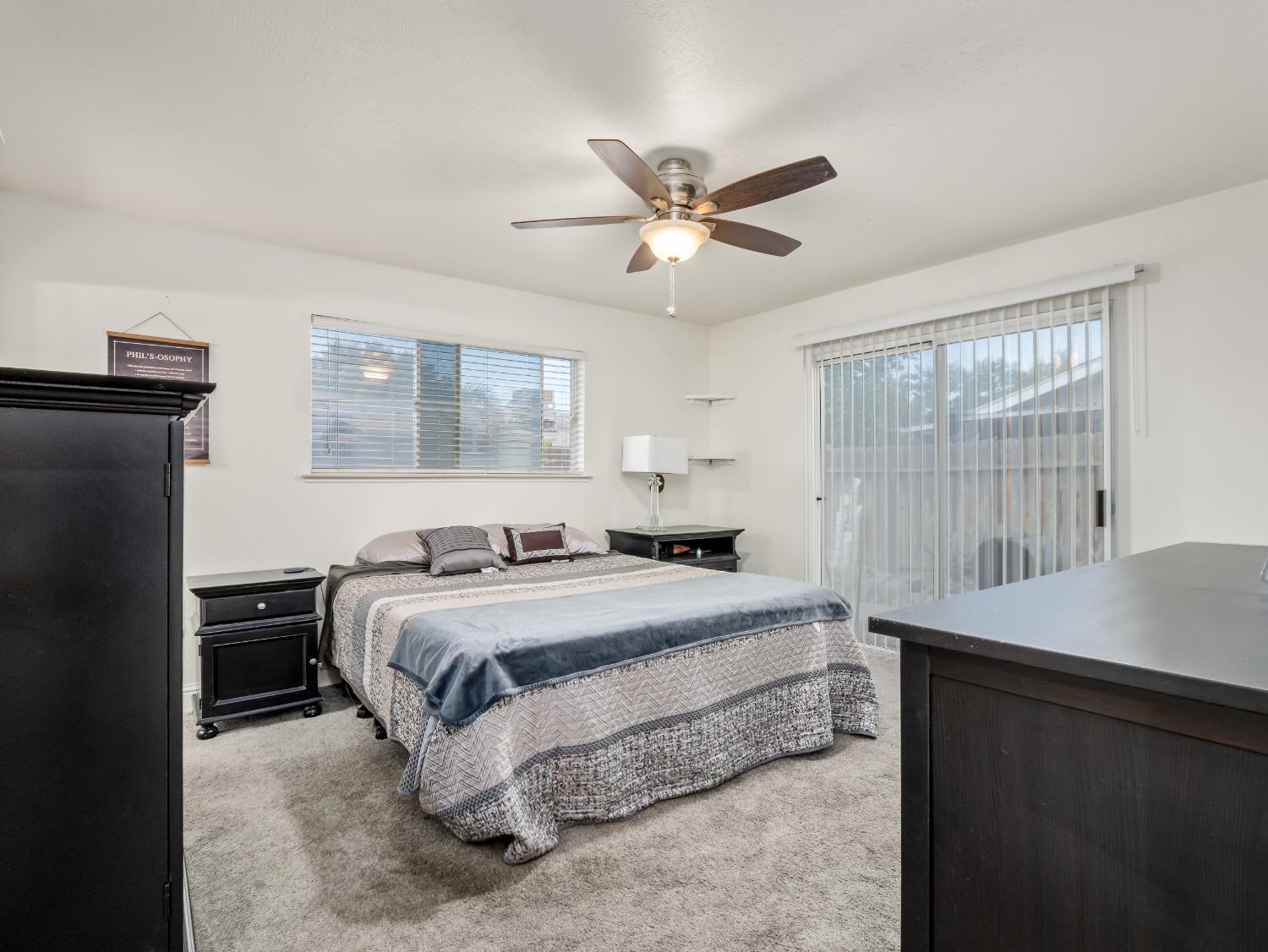 468 Burgan Avenue Clovis, CA 93611 - Photo 15 of 24 a bedroom with a bed and wooden floor