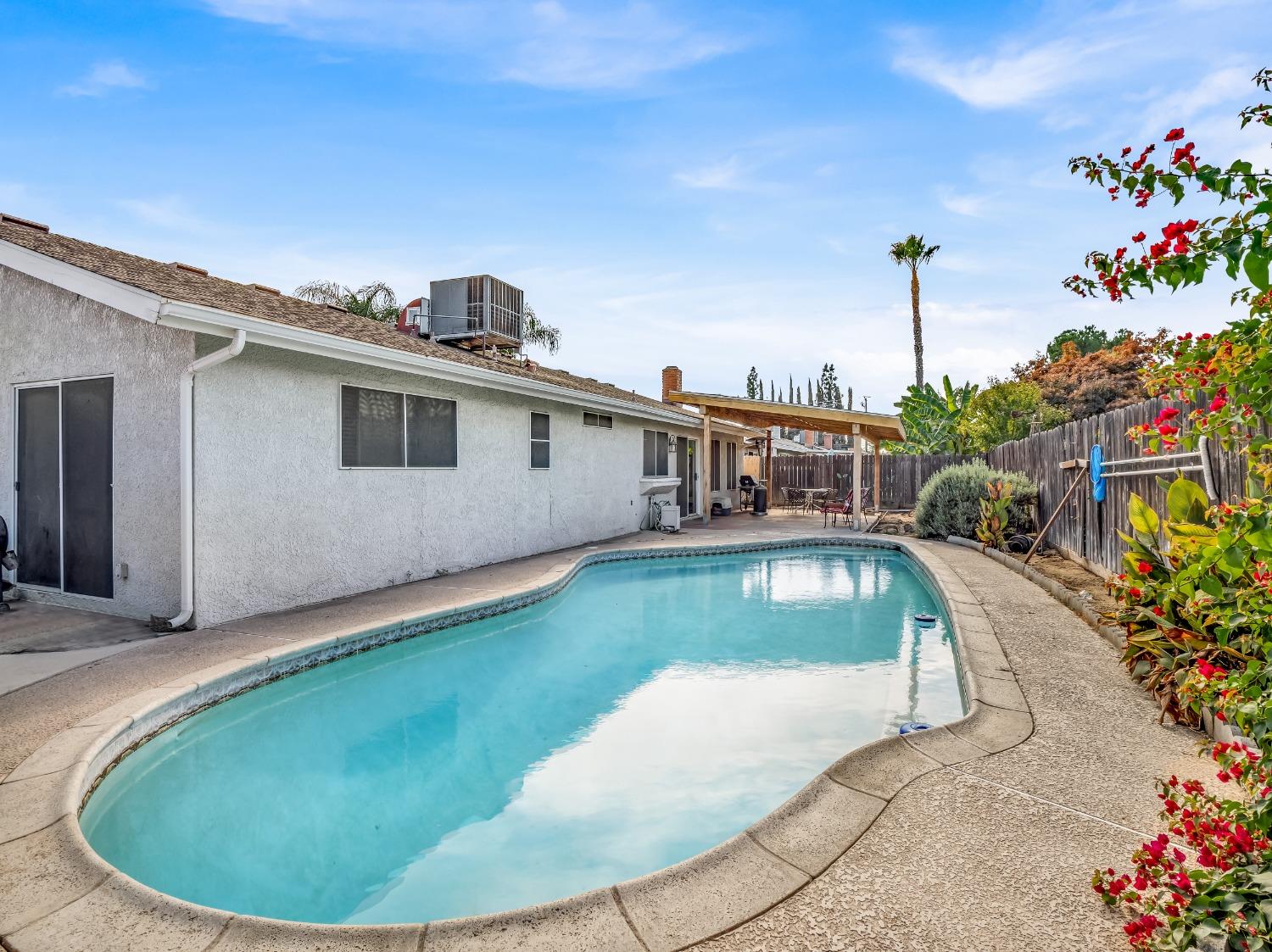 468 Burgan Avenue Clovis, CA 93611 - Photo 24 of 24 a view of a house with swimming pool