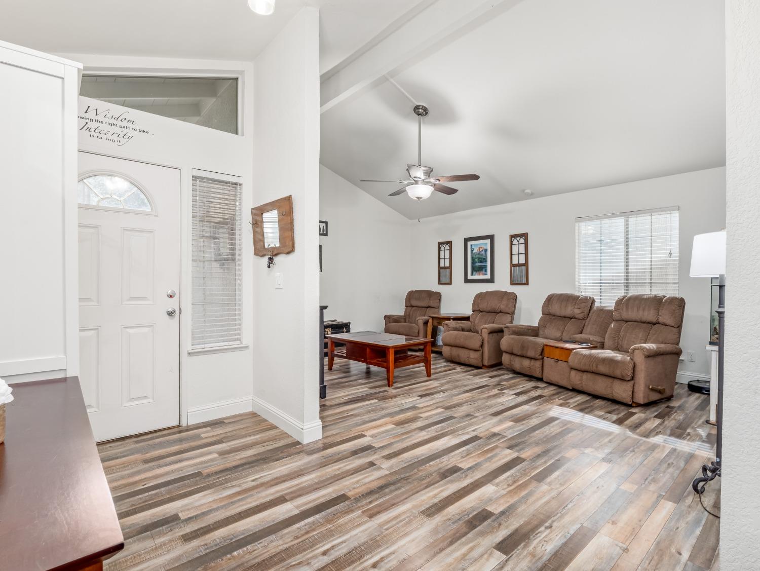 468 Burgan Avenue Clovis, CA 93611 - Photo 4 of 24 a living room with furniture wooden floor and a chandelier