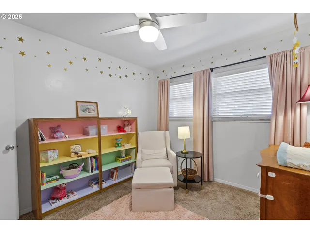 a bedroom with furniture and a window