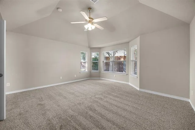 a spacious bathroom with a bathtub sink and mirror
