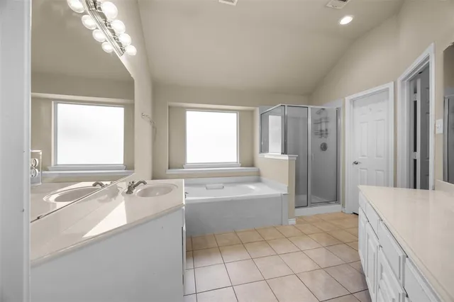 a bathroom with a bathtub and window