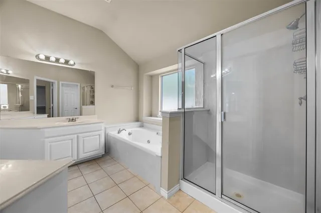 a bathroom with a sink a vanity and a mirror