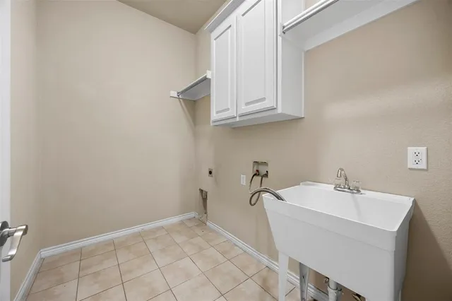 a view of a house with backyard and a trees