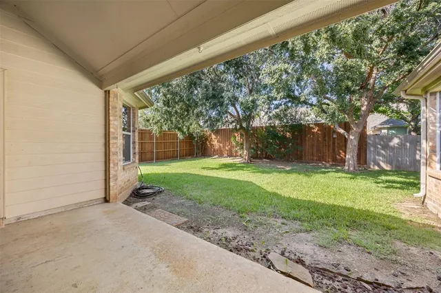 a backyard of a house with seating space