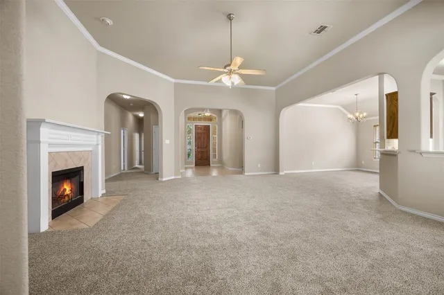 a view of an empty room with a fireplace