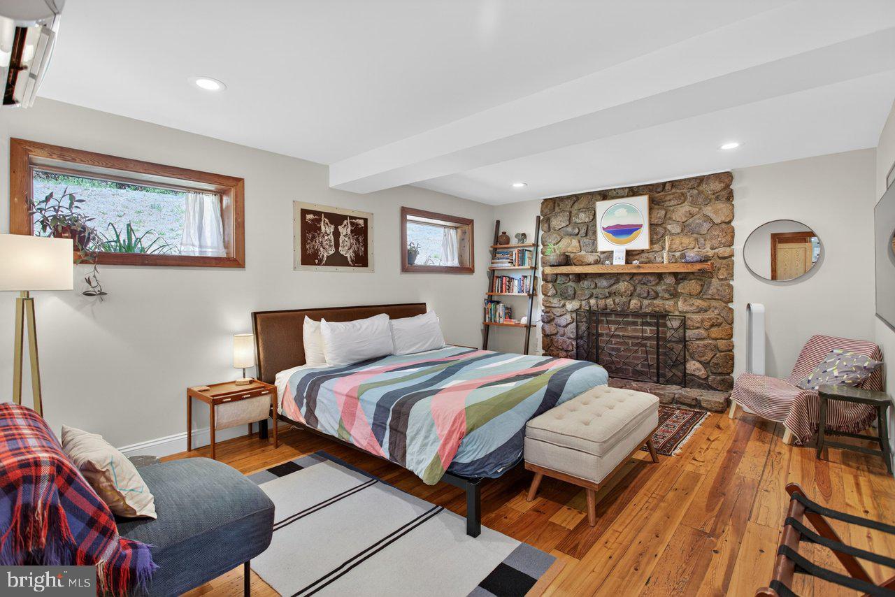 6261 South Page Valley Road Luray, VA 22835 - Photo 20 of 55 a bedroom with a bed and wooden floor