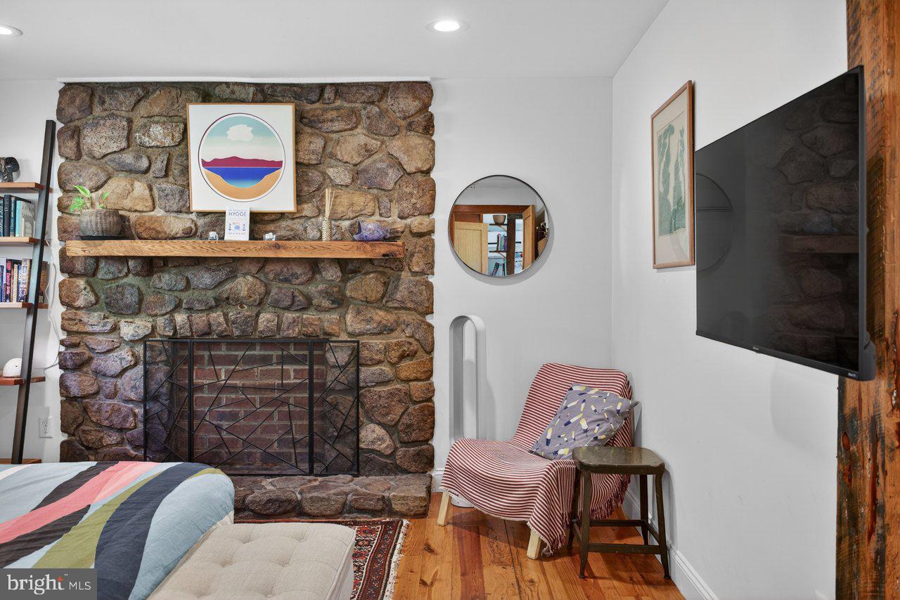6261 South Page Valley Road Luray, VA 22835 - Photo 21 of 55 a bedroom with a bed and a chair in it